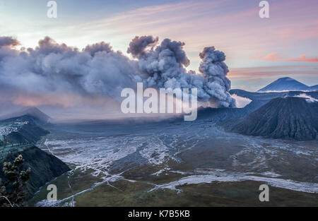 Mount Bromo volcanic eruption and ash coming out from crater, Indonesia Stock Photo
