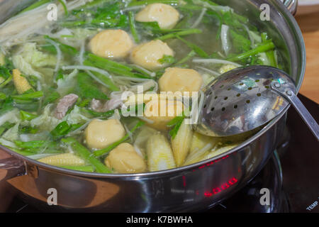 Sukiyaki or Shabu set and mixed vegetables in the boiling pot Stock Photo