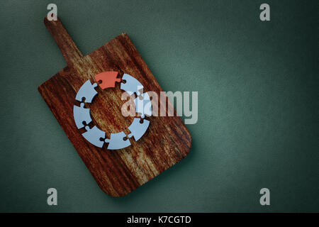 3d rendering of pie chart puzzle on board Stock Photo