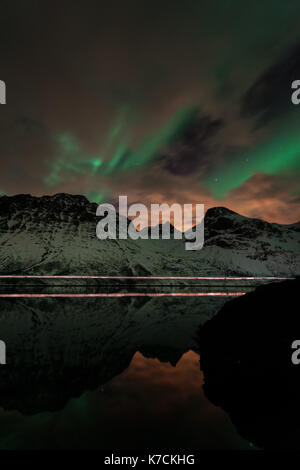 Aurora Borealis, the Northern lights over Tromsoe in northern Norway. Green strong light and a fantastic show during the night. Stock Photo