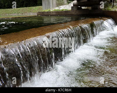 small waterfall, artificial cascade on the river, Stock Photo