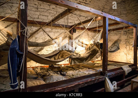 Hammocks hanging inside of the prison in Edinburgh Castle, Scotland Stock Photo