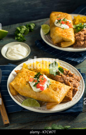 Deep Fried Beef Chimichanga Burrito with Rice and Beans Stock Photo