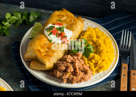 Deep Fried Beef Chimichanga Burrito with Rice and Beans Stock Photo