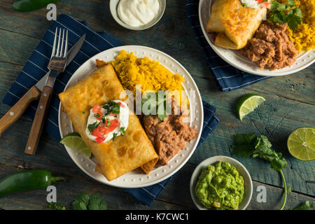 Deep Fried Beef Chimichanga Burrito with Rice and Beans Stock Photo