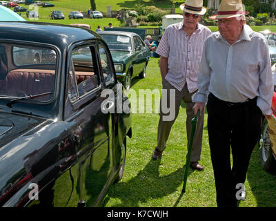 Two men admire a classic car at Firle Vintage Fair in Sussex, England Stock Photo