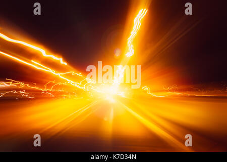 blur hi-power lightning acceleration to high speed on night superhighway road fast moving motion drive with night light trail Stock Photo
