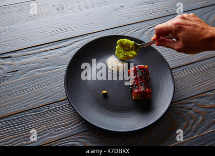 Grilled smoked eel with green apple and citrus with Sichuan Electric flower Stock Photo