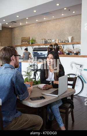 Happy couple spending leisure time in cafeteria Stock Photo