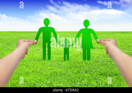 Hands hold paper family, eco concept Stock Photo