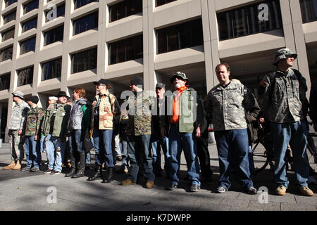 Veterans of the U.S. military gather at the Vietnam Veteran's Plaza before marching through Manhattan's financial district toward Zuccotti Park in New Stock Photo