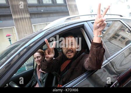 A passing motorist shows his solidarity with protestors marching from the Occupy Wall Street encampment at Zuccotti Park to the New York County Suprem Stock Photo