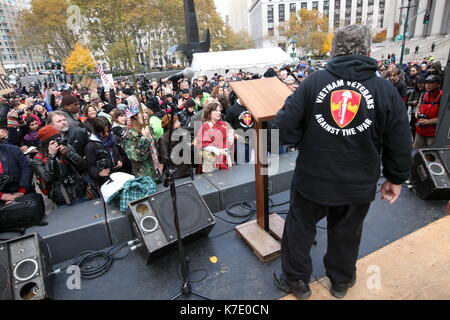 A Veteran speaks at a rally in Foley Square in support of the Occupy Wall Street movement in New York on November 11, 2011. Stock Photo