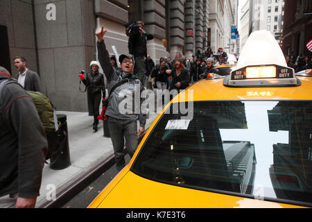 Occupy Wall Street protestors march on Wall Street in New York on November 17, 2011. Stock Photo