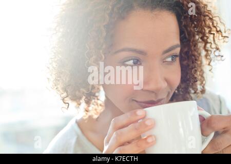 Mid adult woman drinking coffee. Stock Photo