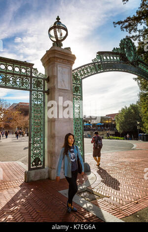 BERKELEY, CA-DEC 8, 2014: University of California at Berkeley at the main entrance into the campus. Students are shown walking Sather Gate. Stock Photo