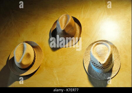Vintage hats hanging on a wall Stock Photo