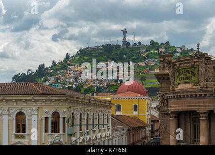 Cityscape of the historic city center of Quito with colonial architecture and the Panecillo hill with apocalyptic virgin in the background, Ecuador. Stock Photo