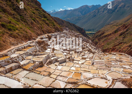 The salt terraces of Maras located in the Sacred Valley of the Inca near the city of Cusco, Peru, South America. Stock Photo