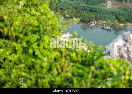 A view of two riverboats on the river Bang Nang Rom from Wat Khao Chong Kaeo, Prachuap Khiri Khan, Thailand, Southeast Asia Stock Photo