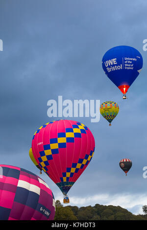 Longleat, Wiltshire UK. 15th September 2017. A mixed day of weather doesn't deter visitors enjoying the Sky Safari hot air balloons at Longleat. Hot air balloons in the sky above the trees in the clouds. Credit: Carolyn Jenkins/Alamy Live News Stock Photo