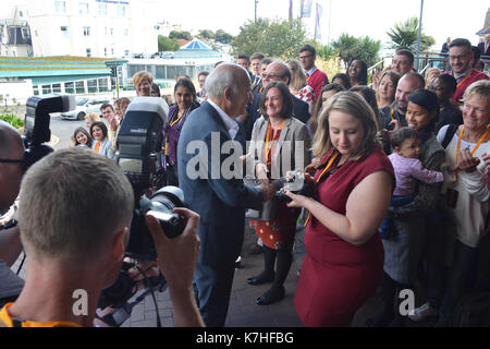 Party leader Vince Cable arrives at Liberal Democrat Autumn Conference in Bournemouth with his wife Rachel, and will be greeted by party activists Stock Photo