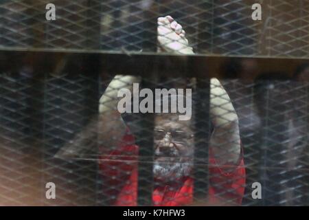 Cairo. 16th Sep, 2017. The file picture taken on June 18, 2016 shows Egyptian ousted president Mohamed Morsi in the defendants' cage during his trial in Cairo, Egypt. An Egyptian court on Sept. 16, 2017 upheld life sentence in prison against the ousted president Mohamed Morsi over charges of spying for Qatar, State-run Nile TV reported. Credit: Ahmed Gomaa/Xinhua/Alamy Live News Stock Photo