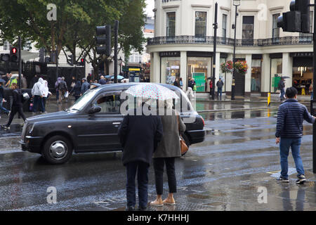 London,UK,16th September 2017,Sudden heavy downpour in The Strand, London sends people dashing for cover on a busy Saturday afternoon.©Keith Larby/Alamy Live News Stock Photo