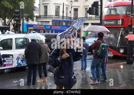 London, UK. 16th Sep, 2017. Sudden heavy downpour in The Strand, London sends people dashing for cover on a busy Saturday afternoon. Credit: Keith Larby/Alamy Live News Stock Photo