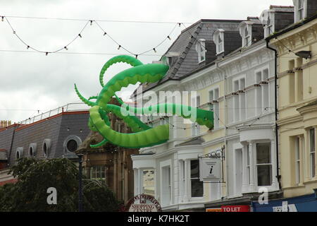 Llandudno,Wales,UK Saturday 16 September 2017  These green tentacles waving from the towns victoria shopping centre are art attacks, a work created by street artist filthy luker as part of the Llawn05 festival. Credit: Mike Clarke/Alamy Live News Stock Photo