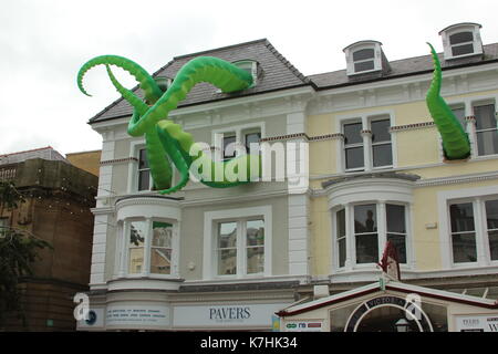 Llandudno,Wales,UK Saturday 16 September 2017  These green tentacles waving from the towns victoria shopping centre are art attacks, a work created by street artist filthy luker as part of the Llawn05 festival. Credit: Mike Clarke/Alamy Live News Stock Photo