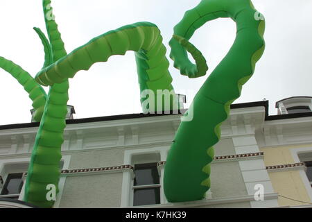 Llandudno,Wales,UK Saturday 16 September 2017  These green tentacles waving from the towns victoria shopping centre are art attacks, a work created by street artist filthy luker as part of the Llawn05 festival. Credit: Mike Clarke/Alamy Live News Stock Photo