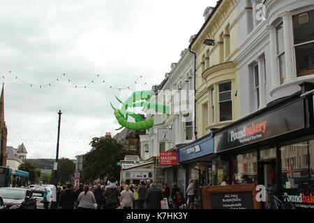 Llandudno,Wales,UK Saturday 16 September 2017  These green tentacles waving from the towns victoria shopping centre are art attacks, a work created by street artist filthy luker as part of the Llawn05 festival. Credit: Mike Clarke/Alamy Live News Stock Photo