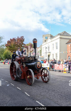 Steam powered traction engine in a carnival procession through Ringwood town centre, New Forest, Hampshire. Stock Photo