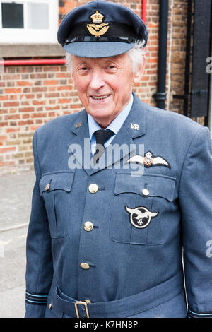 England, Chatham Dockyard. Event, Salute to the forties. Elderly man in RAF officer's uniform with Luftwaffe insignia on as well as RAF insignia. Close up, posed, smiling, eye-contact. Stock Photo