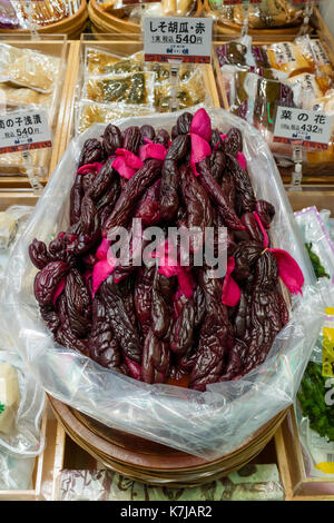 Kyoto, Japan -  May 17, 2017: Red spiced eggplants for sale at the Nishiki Market Stock Photo