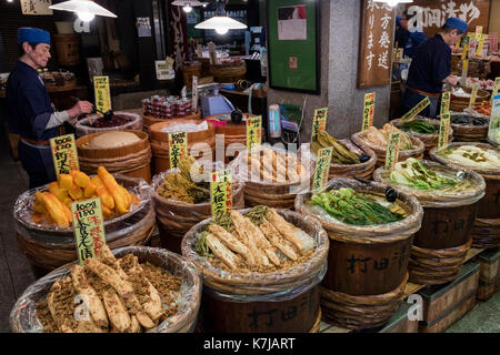 Kyoto, Japan -  May 17, 2017: Preserved vegetables in wooden barrels, tsukemono, for sale on the Nishiki market Stock Photo