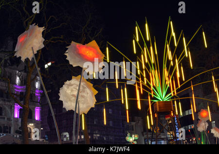 Photo Must Be Credited ©Alpha Press 066465 16/01/2016 Garden of Light by TILT in Leicester Square at the Lumiere London Light Festival. TILT is a French collective that reclaim public space for their art. They create luminous, dreamlike structures using recycled materials processed to high technical production quality. Founders Francois Fouilhe and Jean Baptiste Laude started the collective to give prominence to light art and to encourage audiences to view it from a new perspective. Enjoy this magical collection of plant sculptures. Forget about the cold; let the glow of giant flowers and tree Stock Photo