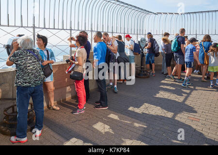 Empire State Building observation deck with people and tourists in New York Stock Photo