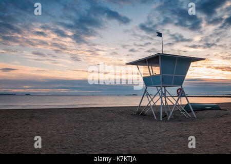 Lifeguard Tower on the Beach at Sunset during the Summer in Finland Stock Photo