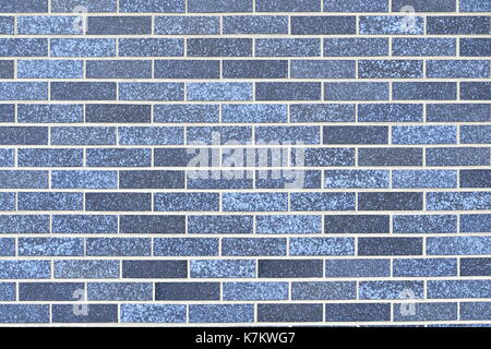 horizontal background of brick wall built of blue bricks Stock Photo