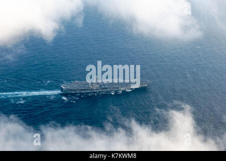 The Nimitz-class aircraft carrier USS John C. Stennis (CVN 74) transits the Pacific Ocean. Stock Photo