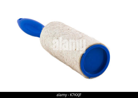 Dirty Adhesive roller for cleaning clothes from animal fur and hair isolated on white background photo. Beautiful picture, background, wallpaper Stock Photo