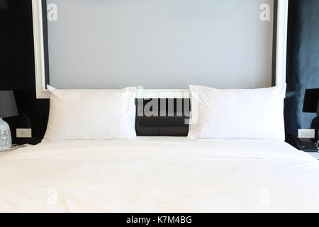 Bed in the bedroom,concept of relaxation interior. Stock Photo