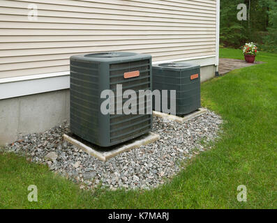 Heating and air conditioning units in back of an apartment complex Stock Photo