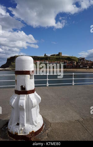 White capstan on harbour wall at Whitby, North Yorkshire. Stock Photo