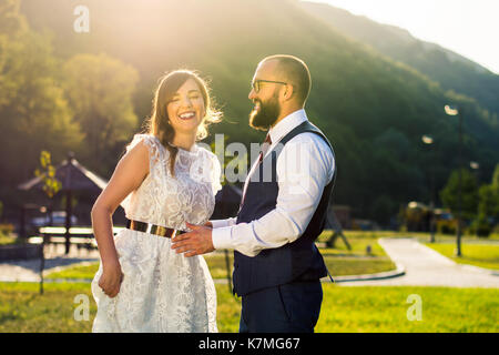 Happy bride and groom at wedding ceremony outdoors Stock Photo