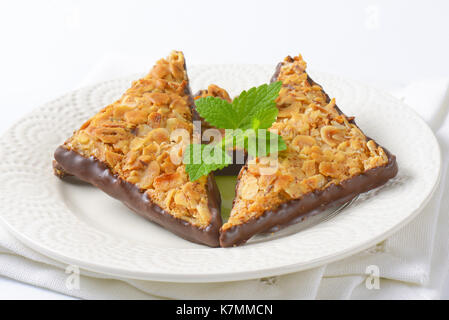 Triangle nut bars dipped in chocolate Stock Photo