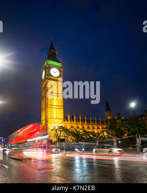 Red double-decker bus in front of Big Ben, Houses of Parliament, light tracks, night scene, City of Westminster, London