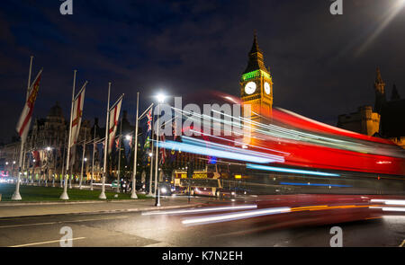 Red double-decker bus in front of Big Ben, Houses of Parliament, light tracks, night scene, City of Westminster, London Stock Photo